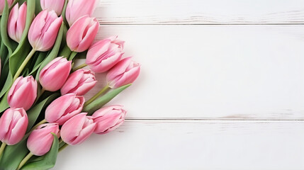 Pink tulips bouquet on a white wooden table mothers day