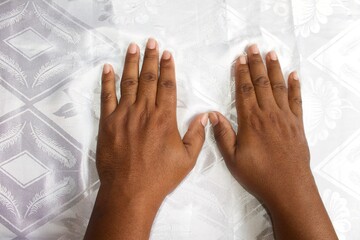 Black male hands close up on white background
