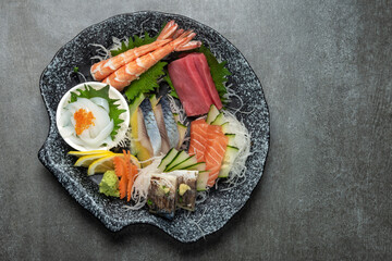 mixed sashimi plate in japanese restaurant on grey background - 661748014