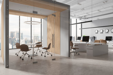 Gray and wooden open space office and meeting room with clocks