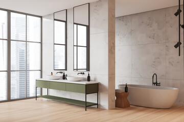 White marble bathroom corner with tub and double sink