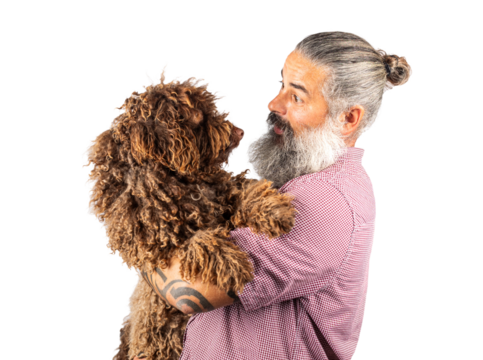Studio portrait of a hipster man hugging his dog. Man playing with dog Isolated on transparent background.