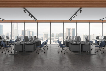 Modern office interior with pc monitors on desk, drawer near panoramic window