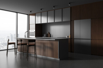Island and cabinets in gray and wooden kitchen interior