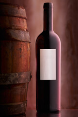 red wine bottle and barrel on dreamy back drop