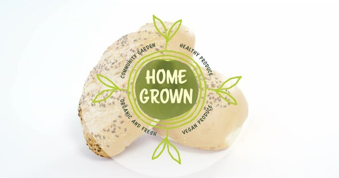 Animation of home grown text banner against close up of fresh bread on white background
