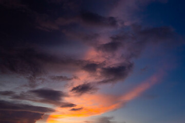 Naklejka na ściany i meble twilight sky with sun beam in evening time. dark cloud with