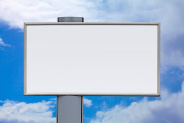 Blank billboard against a cloudy sky