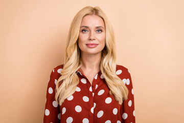 Portrait photo of young confident business lady wear dotted red shirt serious face serious company owner isolated on beige color background