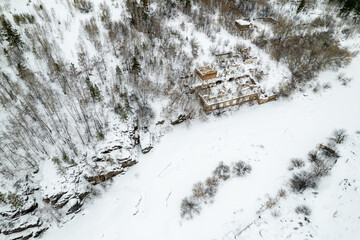 winter landscape of an abandoned building covered with snow