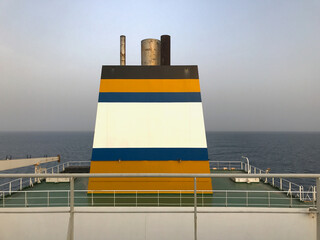 View of the funnel of a merchant ship at sea