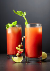 Cocktail Bloody Mary on a black background.