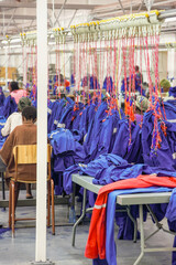 industrial textile factory in africa producing workwear, the sewing hall with the automated line