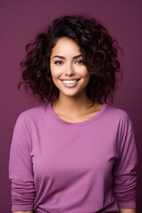 Fototapeta premium A studio portrait of a young ebony woman, smiling for the camera.