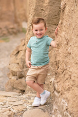 Smiling boy exploring in woods