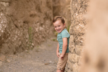 Smiling boy exploring in woods