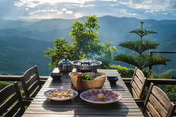 dinner with a Thai BBQ at sunset in the mountains of Doi Chang Chiang Rai Thailand - obrazy, fototapety, plakaty