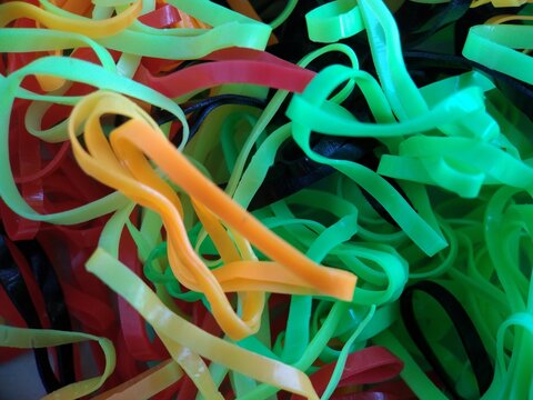 colorful rubber bands that looked like noodles
