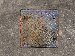 Rusted manhole cover, grunge style manhole cover, square edge,