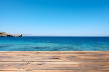 Fototapeta premium Serene coastal view: Wooden table against a backdrop of azure sea, distant island, and clear blue sky. High-quality image.