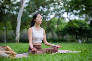 Woman do meditation at park