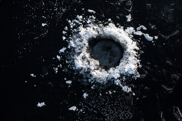 Frosty ice fishing hole. Winter fishing - Powered by Adobe