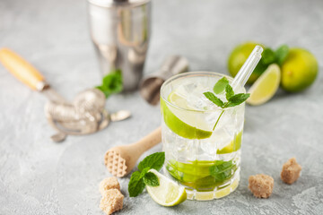 Caipiroska cocktail with lime and mint in rocks glass