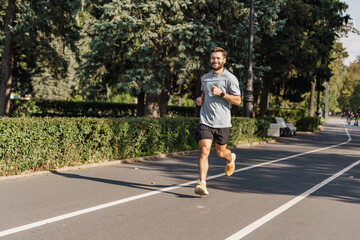 Training development of the cardiac system. Warm-up runner happy uses sportswear.  A hardy young...