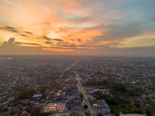 Naklejka premium Aerial view of Pekanbaru city skyline during sunset. Capital city of Riau province in Indonesia.