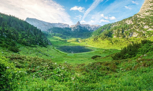 Bavarian hiking nature landscape with lake and scenic mountain background
