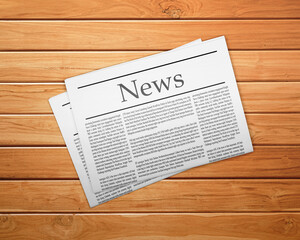 Fototapeta na wymiar A newspaper on a wooden desk, newspaper with the headline News