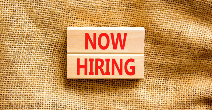 Now hiring symbol. Concept words Now hiring on beautiful wooden block. Beautiful canvas table canvas background. Business marketing, motivational now hiring concept. Copy space. - Powered by Adobe