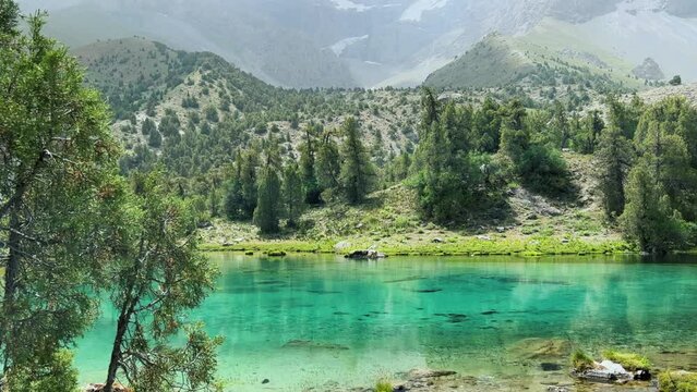 The Alaudin (Chapdara) lakes, lying at an altitude of 2800 m, are considered one of the most beautiful lakes of the Fan Mountains. Turquoise mountain lake. Pamiro-Alai. Tajikistan, Pamir 4K