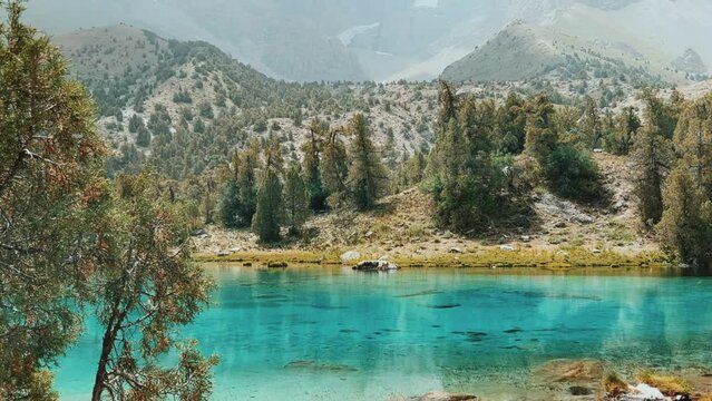 The Alaudin (Chapdara) lakes, lying at an altitude of 2800 m, are considered one of the most beautiful lakes of the Fan Mountains. Turquoise mountain lake. Pamiro-Alai. Tajikistan, Pamir 4K