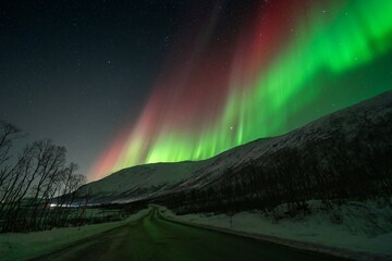 Rare red northern lights, Red Aurora Borealis. High quality photo - 661847825