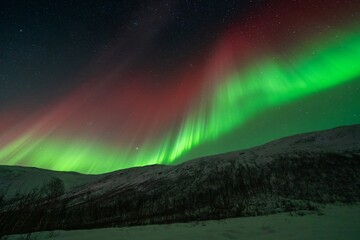 Rare red northern lights, Red Aurora Borealis. High quality photo - 661848019
