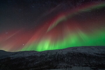 Rare red northern lights, Red Aurora Borealis. High quality photo - 661848296