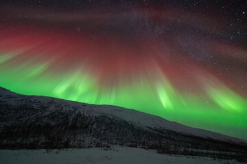 Rare red northern lights, Red Aurora Borealis. High quality photo - 661848401