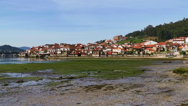 Typical village of Combarro on the coast, facing the sea at low tide. Galicia, Spain