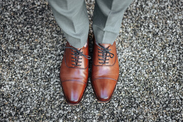 Groom's brown shoes close-up on his wedding day