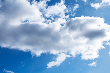 White clouds against a blue sky.