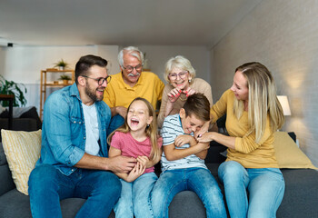 child family portrait woman mother man father grandmother daughter group smiling happy adult girl grandparent generation female grandchild together senior grandfather son boy three - Powered by Adobe
