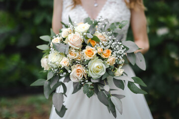 Bride holding her wedding flower bouquet close-up