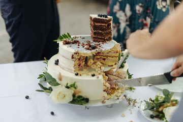 Cut cake at a wedding buffet