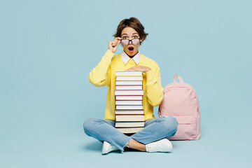 Full body young shocked amazed woman student wear casual clothes sweater backpack bag lower glasses...