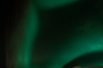 Fototapeta na wymiar Spectacular Aurora Borealis over the starry sky of Iceland, northern lights