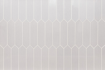 Tan picket tiles with white grout used for showers, flooring, and kitchen backsplashes.