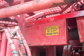 Caution safety sign of moving part inside the machine, dangerous for hand and finger injury....