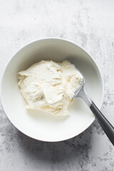 Creaming butter and sugar with a whisk, the process of making a cake, mixing butter and sugar to make a cake