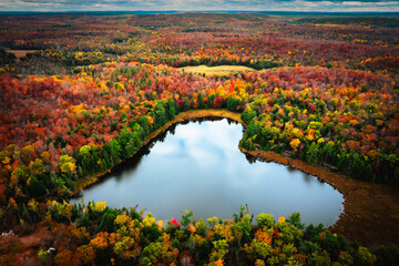 Fall Landscape Drone Shot of Heart Lake Amidst Autumn Splendor- Ompah, Ontario